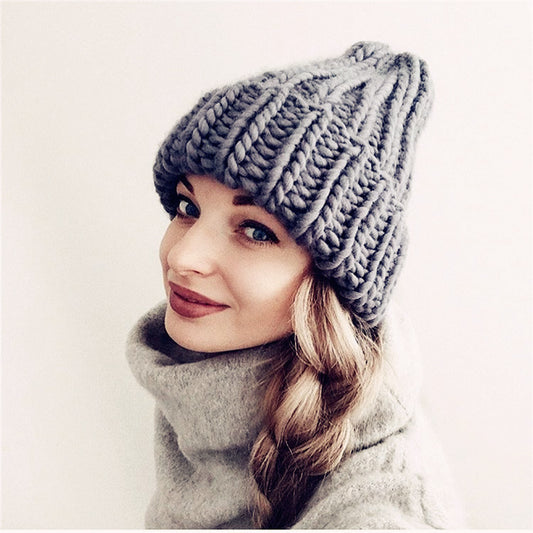 Europe and the United States new knit hat ladies autumn and winter fashion wild thick wool hat solid color simple earmuffs