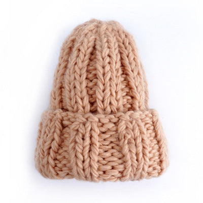 Europe and the United States new knit hat ladies autumn and winter fashion wild thick wool hat solid color simple earmuffs